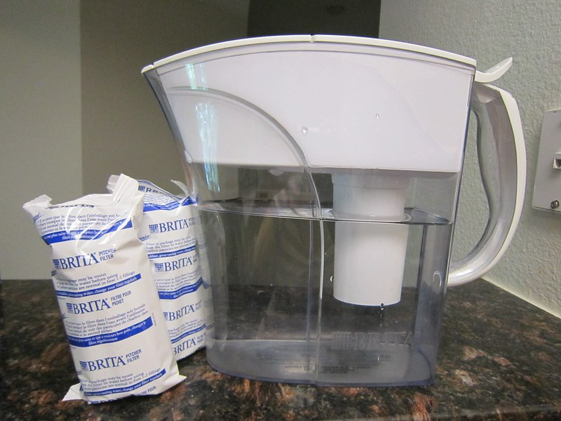 How long do Brita filters last: Brita style water filter pitcher being filled with tap water